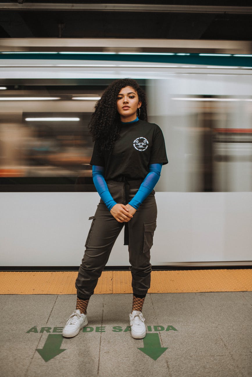 woman standing in front of train
